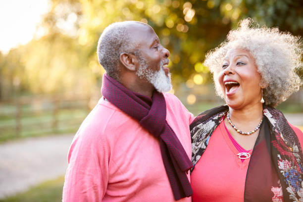 A happy senior couple in active retirement enjoys a walk together